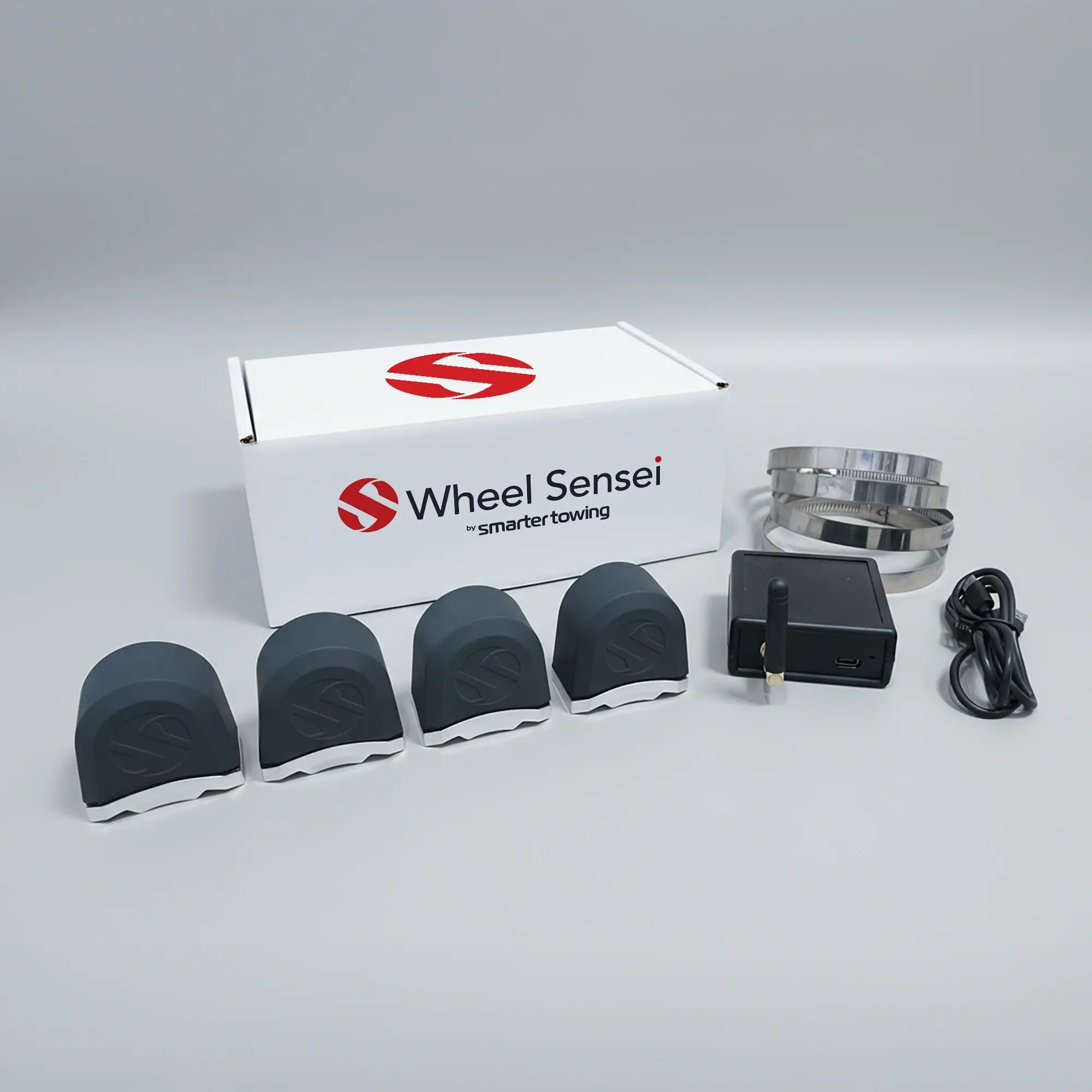 Dual Axle TPMS Bundle by Smarter Towing — includes 4 x wheel sensei sensor units, ring clamps, data box, USB-C cable and activation code for real-time tyre pressure and wheel bearing monitoring on trailers and caravans.