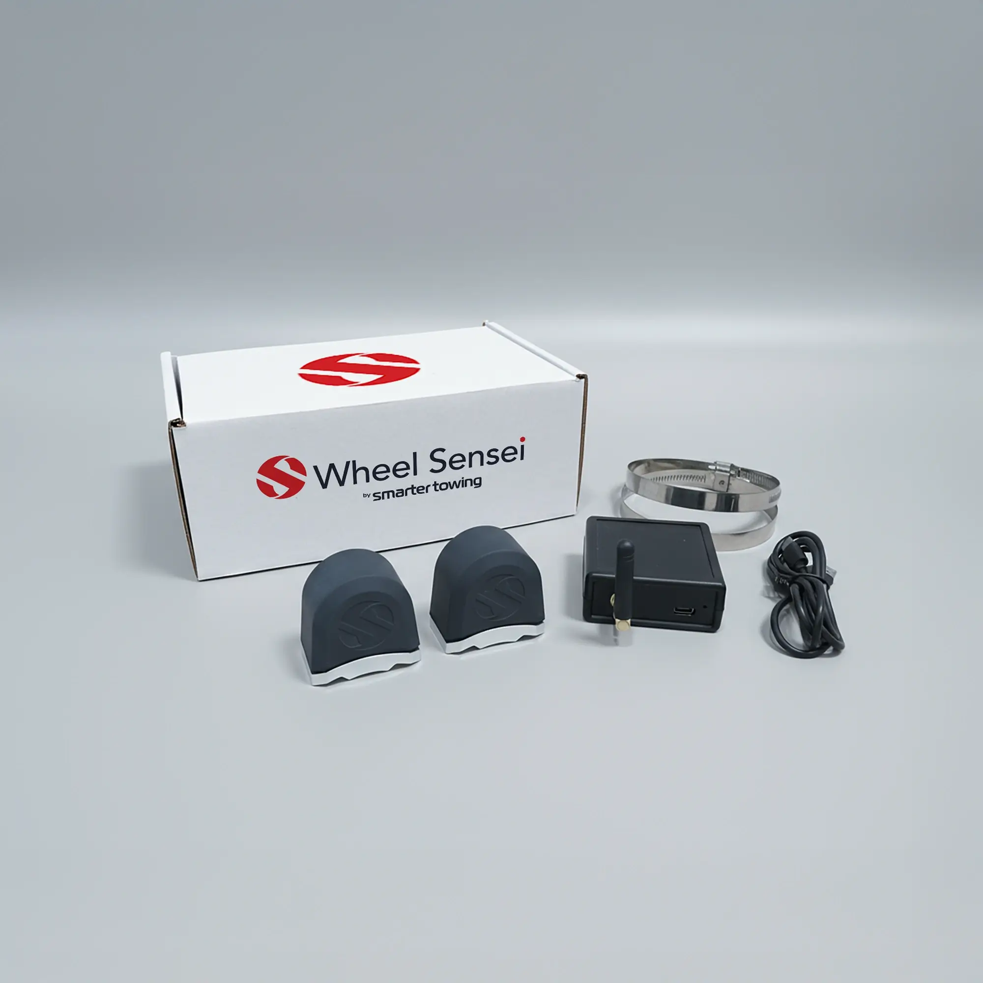 Single Axle Wheel Sensei Smart Towing Kit by Smarter Towing - includes 2 x wheel sensei sensor units, ring clamps, data box, USB-C cable and activation code for real-time tyre pressure and bearing monitoring on trailers and caravans.